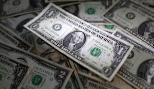 Dollar heads for weekly rise, yen slumps ahead of Japan's election