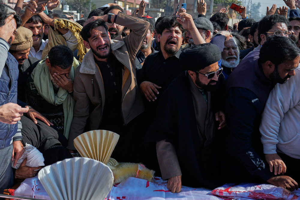 Thousands mourn victims of suicide bombing in Islamabad, as four arrests made