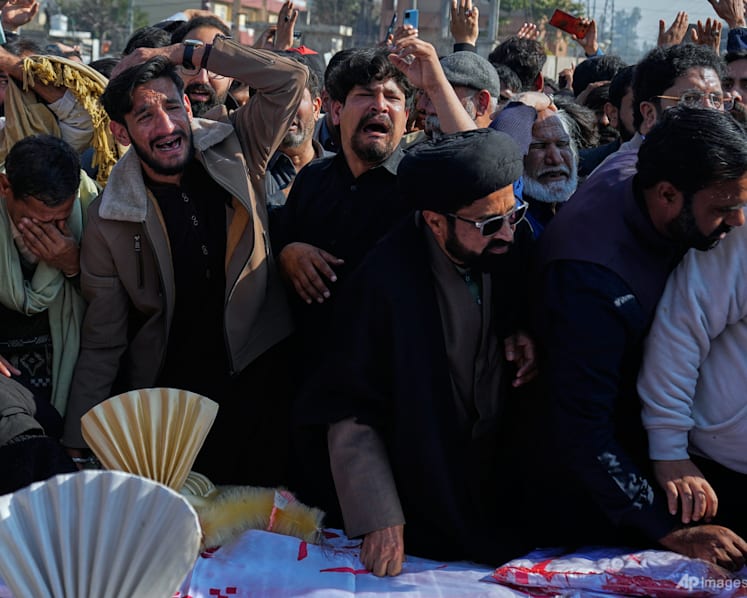 Thousands mourn victims of suicide bombing in Islamabad, as four arrests made